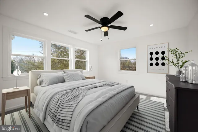 a bedroom with a large bed and a window