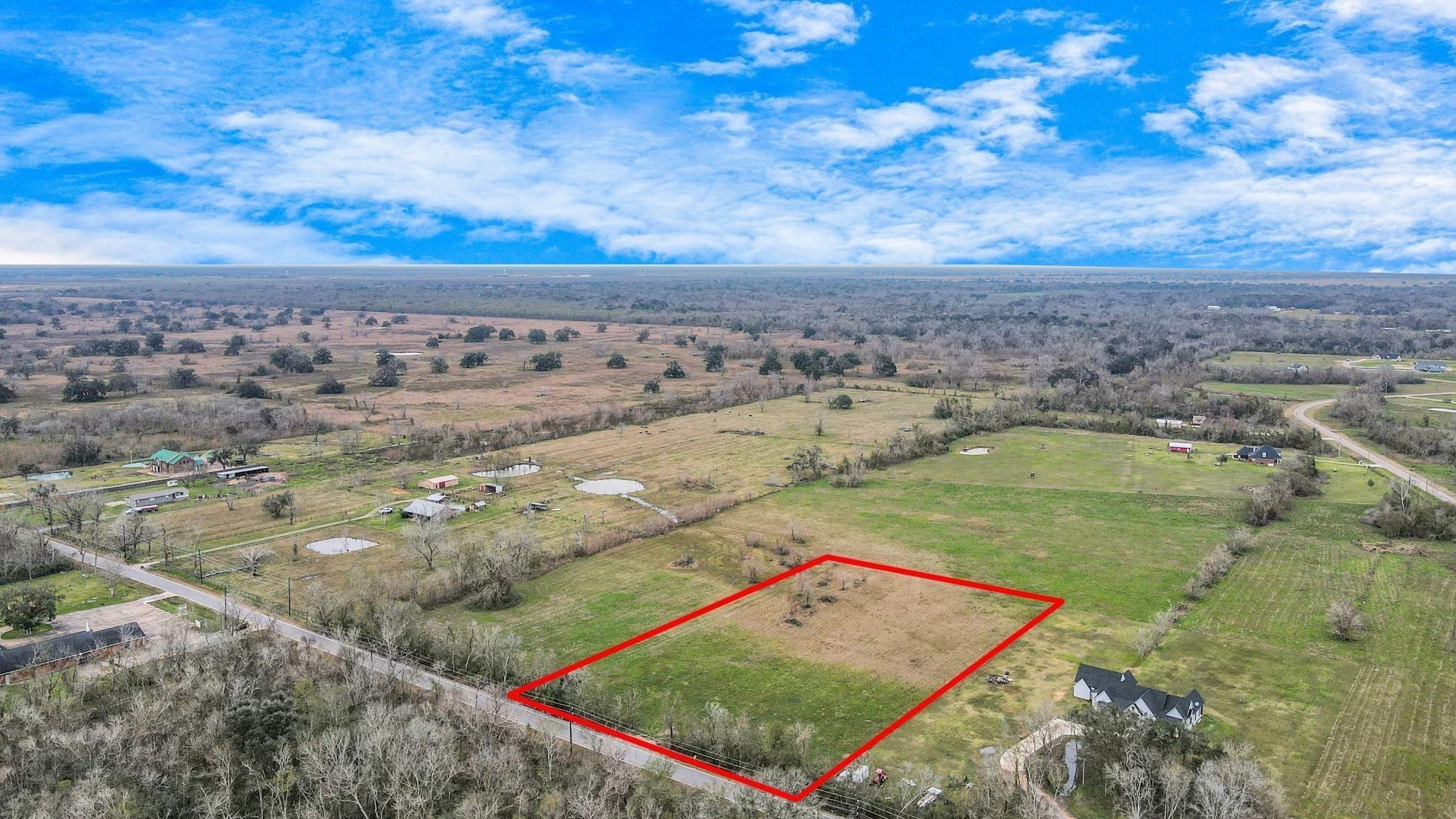 1402 County Road 34 Angleton, TX 77515 - Photo 6 of 10 a view of a field with an ocean view