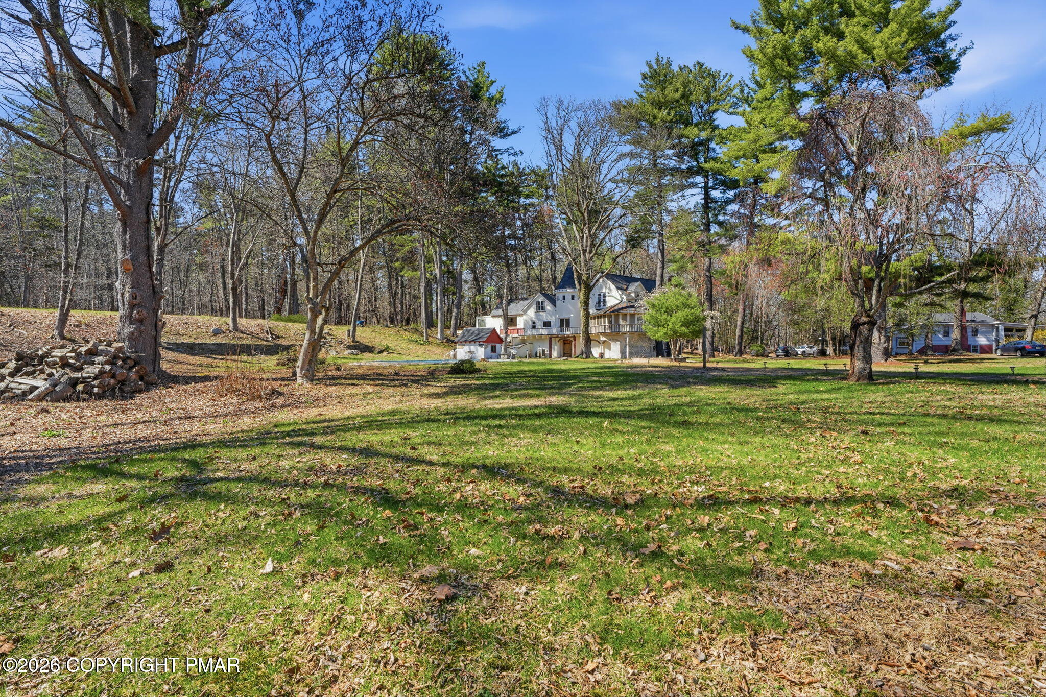 720 Stokes Mill Road East Stroudsburg, PA 18301 - Photo 64 of 87 a backyard of apartments with large trees
