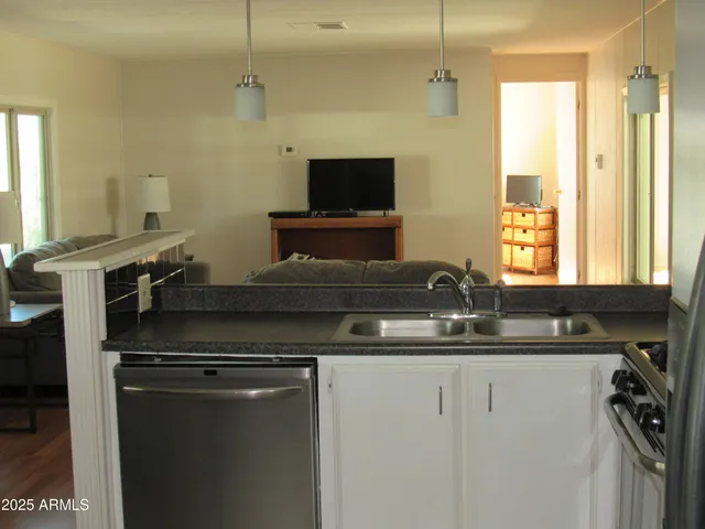 a kitchen with a sink and a window