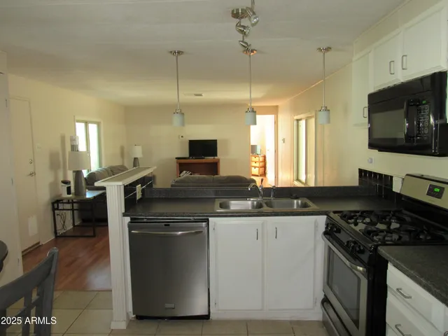 a kitchen with a stove and a sink