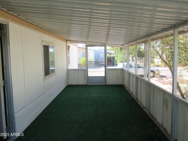 a view of an empty room with a porch