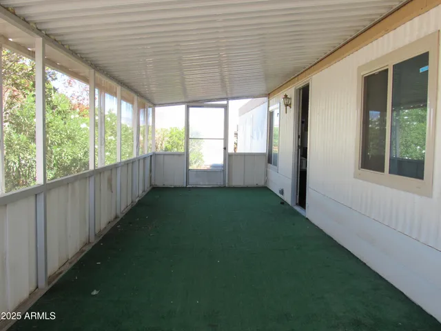 a view of a porch with a backyard