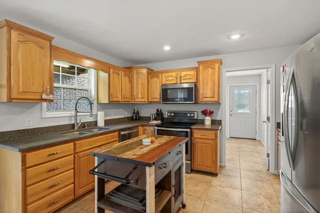 a utility room with sink dryer and washer