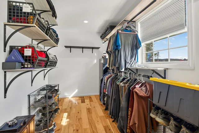 a view of a patio with a dining table and chairs with wooden floor