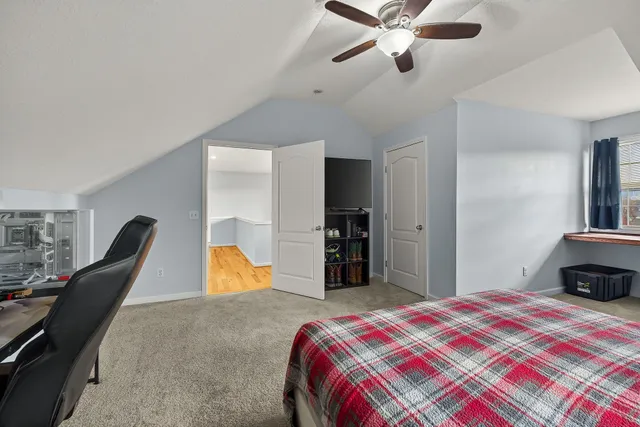 a view of a garage with a bike and car