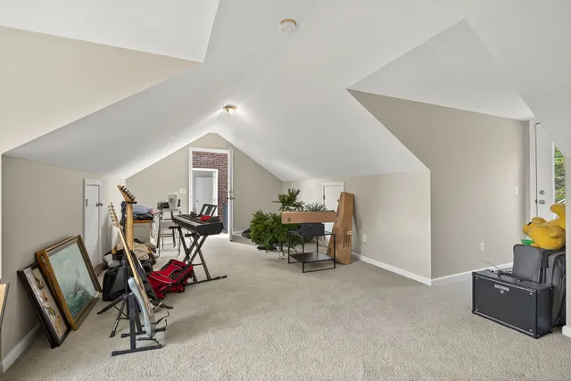 a front view of a house with a yard table and chairs
