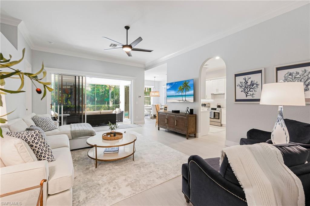 19013 Ridgepoint Drive Estero, FL 33928 - Photo 3 of 42 a living room with furniture and a large window