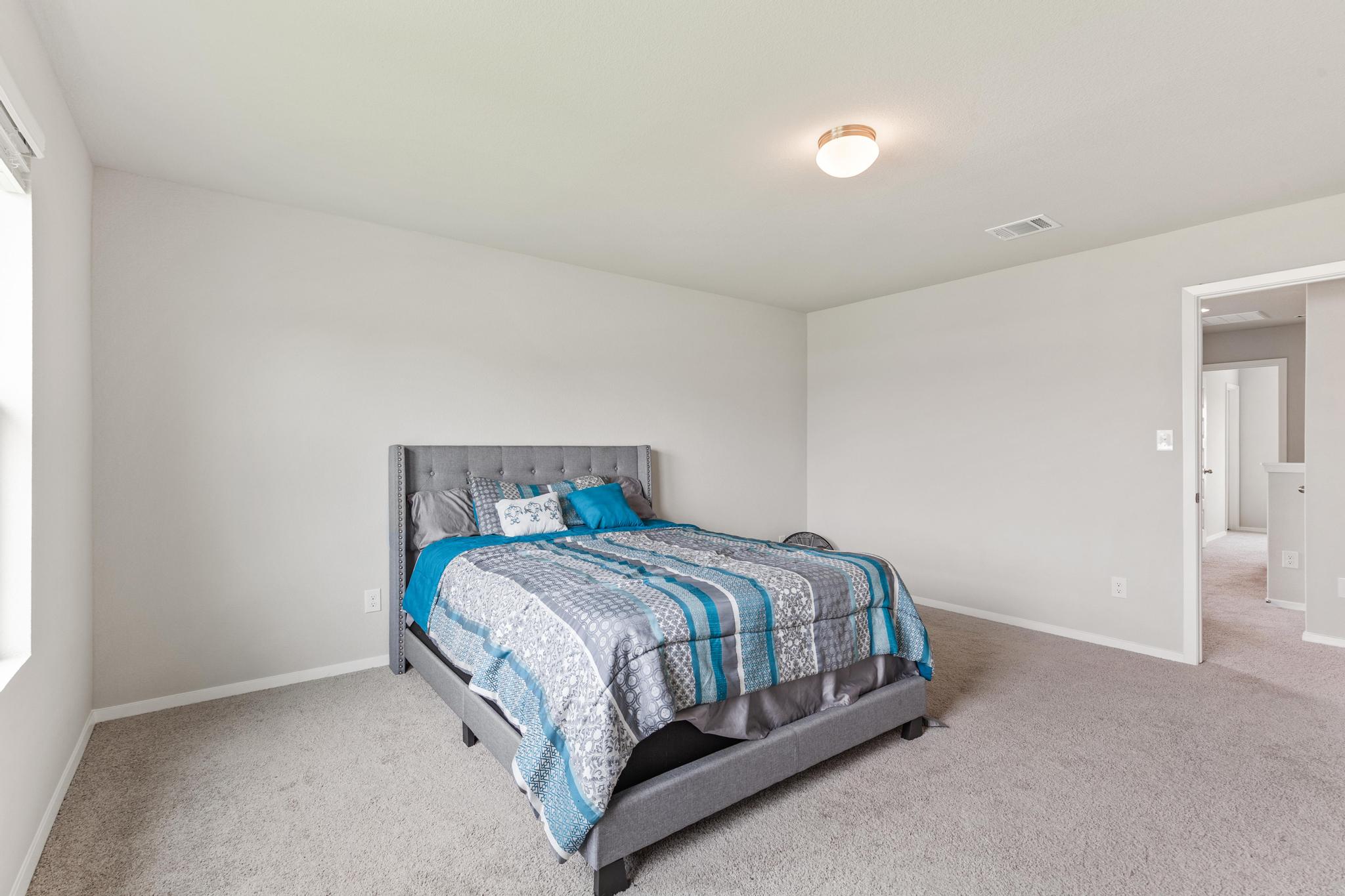 242 Barley Lane Elgin, TX 78621 - Photo 25 of 31 Spacious room featuring light gray carpeting, neutral wall color, overhead flush mount lighting, and a window with white trim