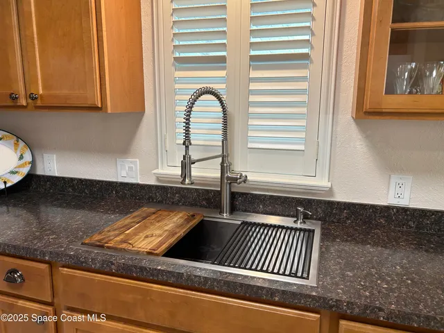 a stove top oven sitting inside of a kitchen
