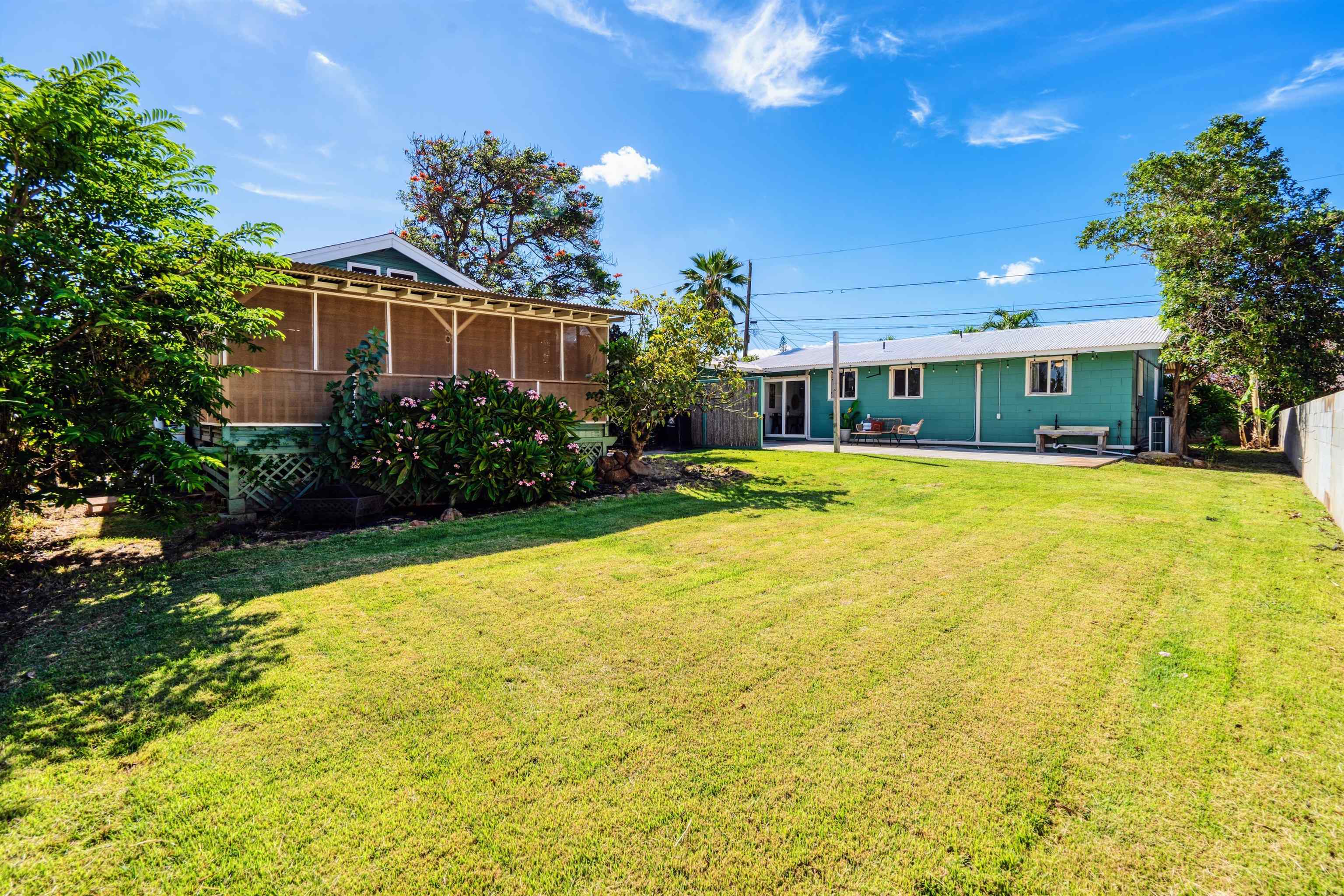 339 Manini Place Kihei, HI 96753 - Photo 21 of 34 a front view of house with yard and trees