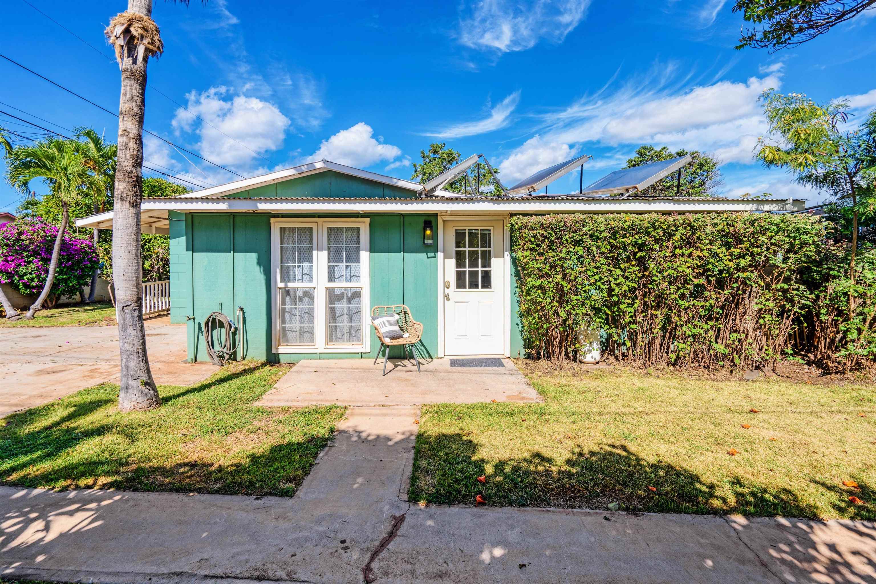339 Manini Place Kihei, HI 96753 - Photo 25 of 34 a front view of a house with garden