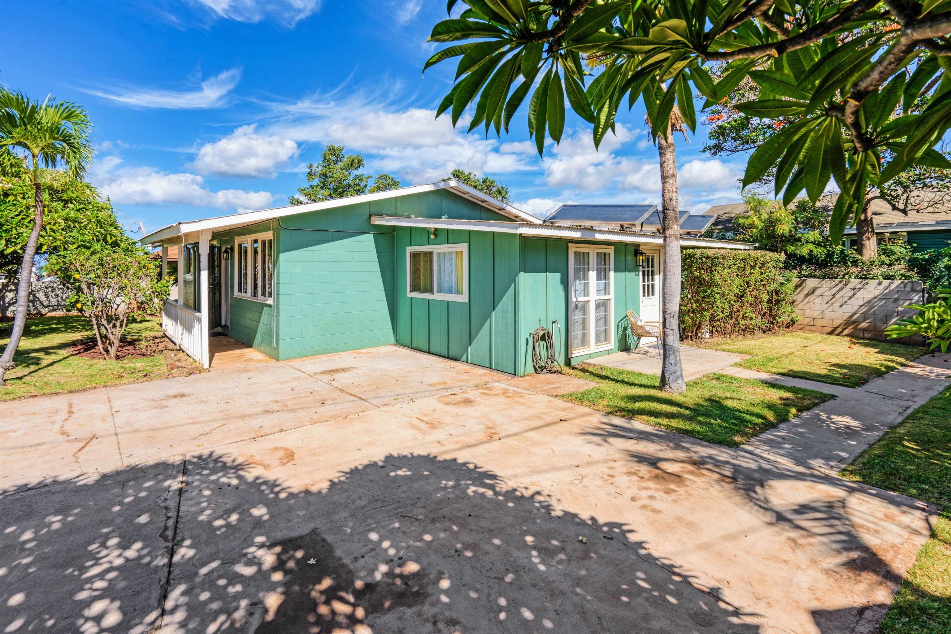 339 Manini Place Kihei, HI 96753 - Photo 26 of 34 a front view of a house with garden