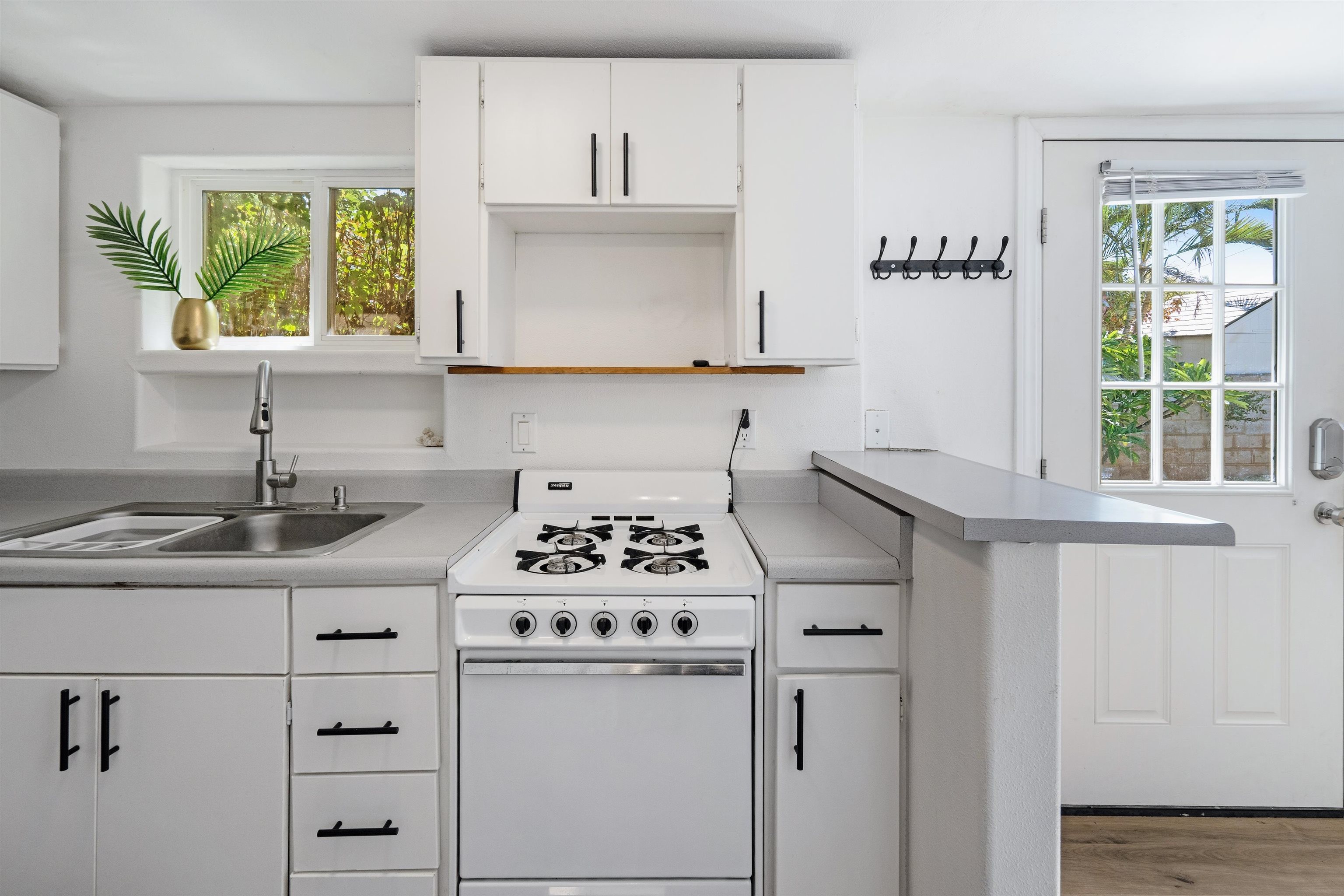 339 Manini Place Kihei, HI 96753 - Photo 32 of 34 a kitchen with appliances cabinets and a window