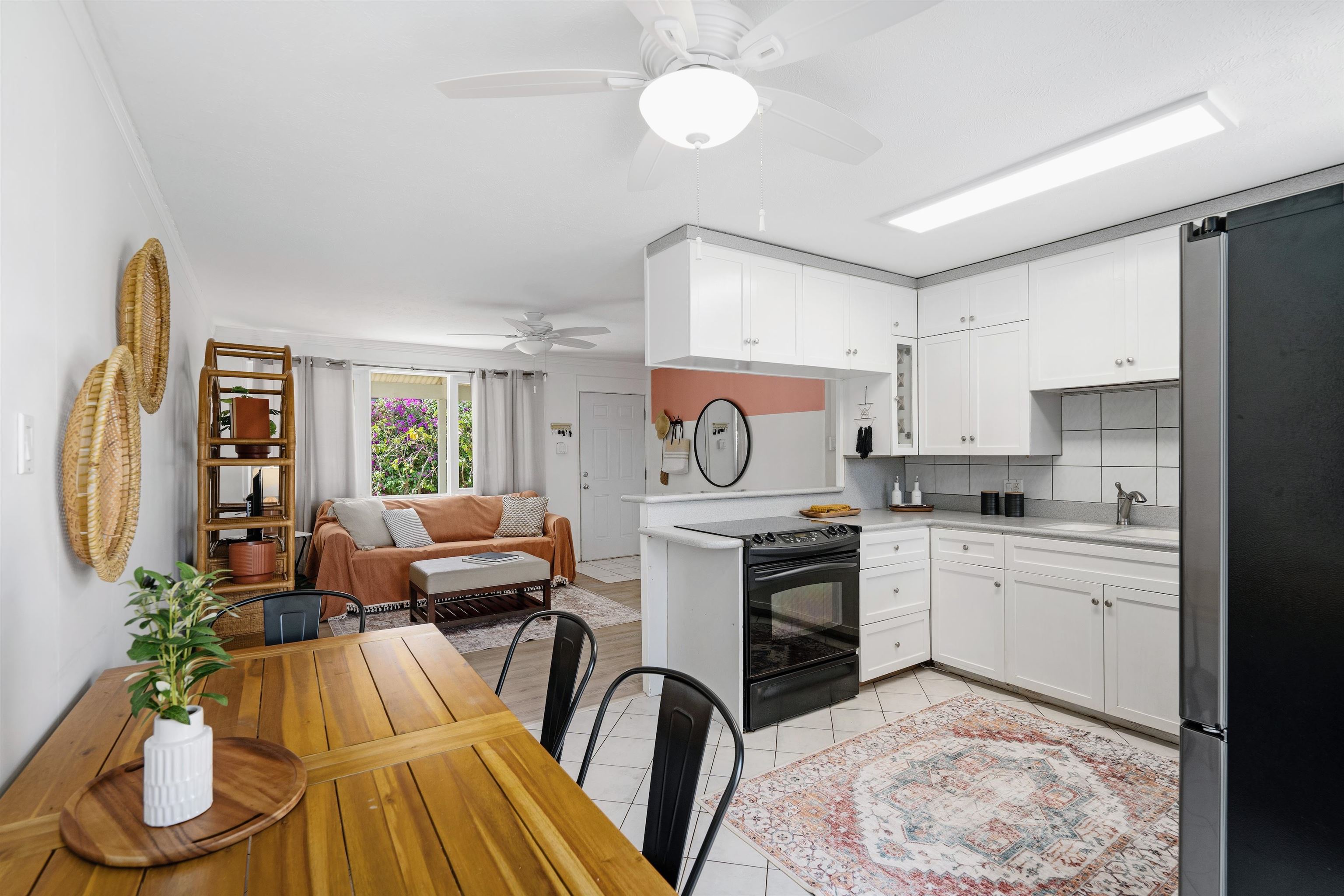 339 Manini Place Kihei, HI 96753 - Photo 7 of 34 a kitchen with furniture a refrigerator and a stove