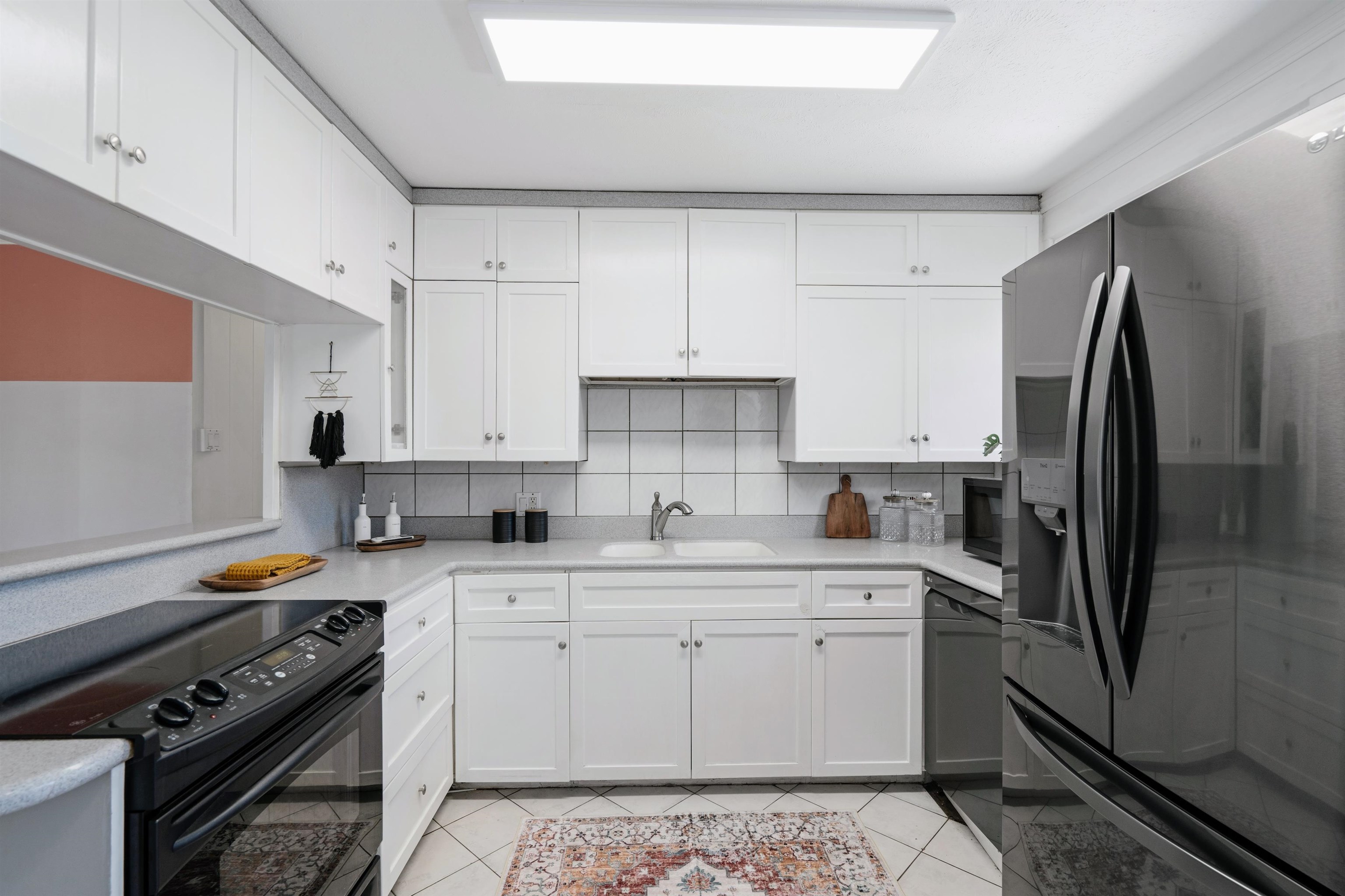 339 Manini Place Kihei, HI 96753 - Photo 8 of 34 a kitchen with stainless steel appliances a stove a sink and a refrigerator