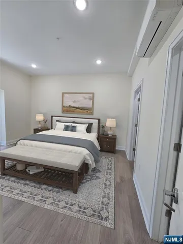 a bedroom with a bed and a mirror