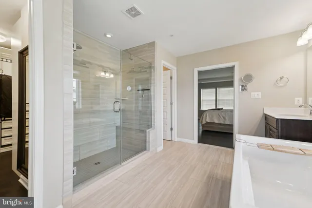 a bathroom with a shower and a sink