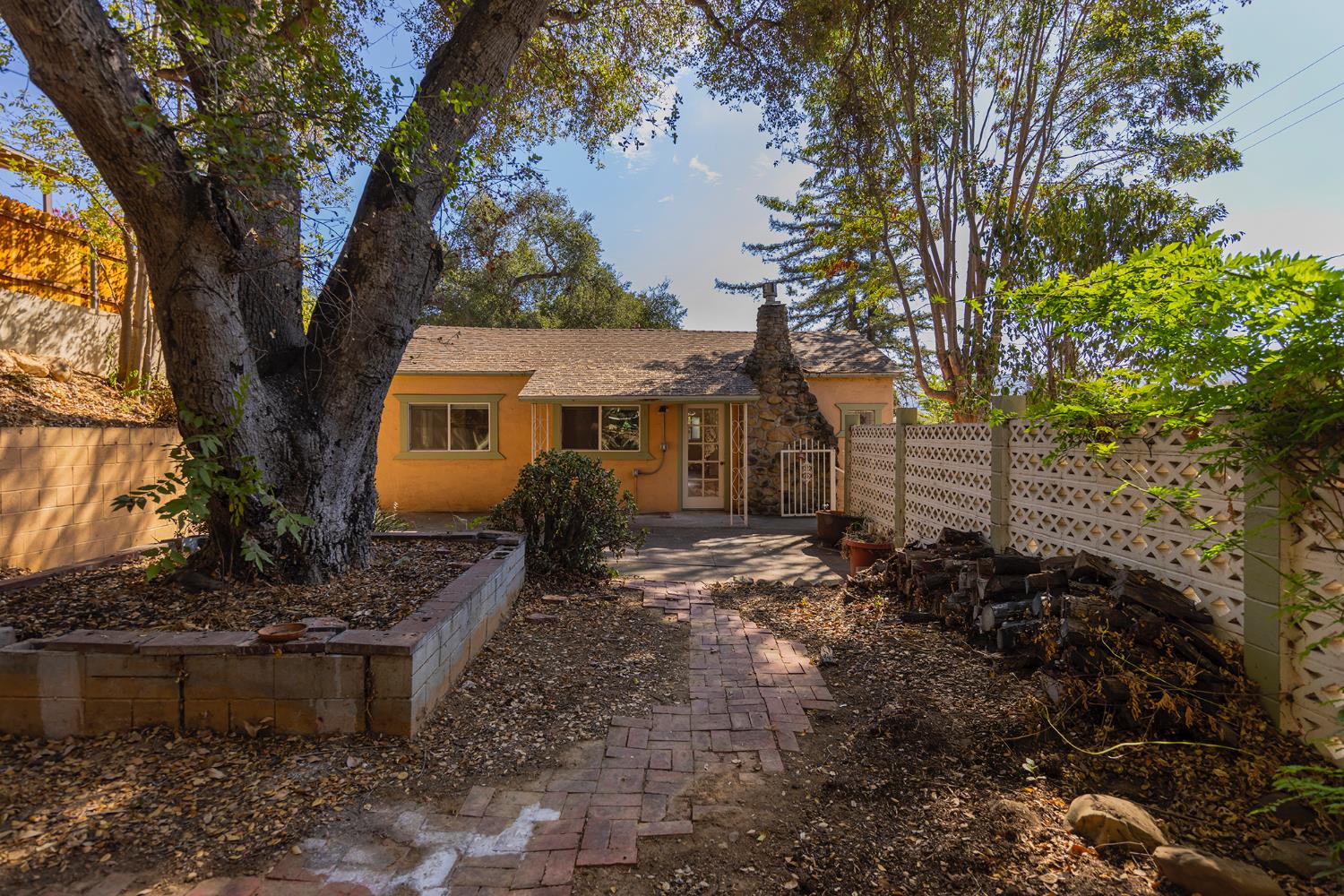 228 High Street Oak View, CA 93022 - Photo 16 of 28 a front view of a house with a yard