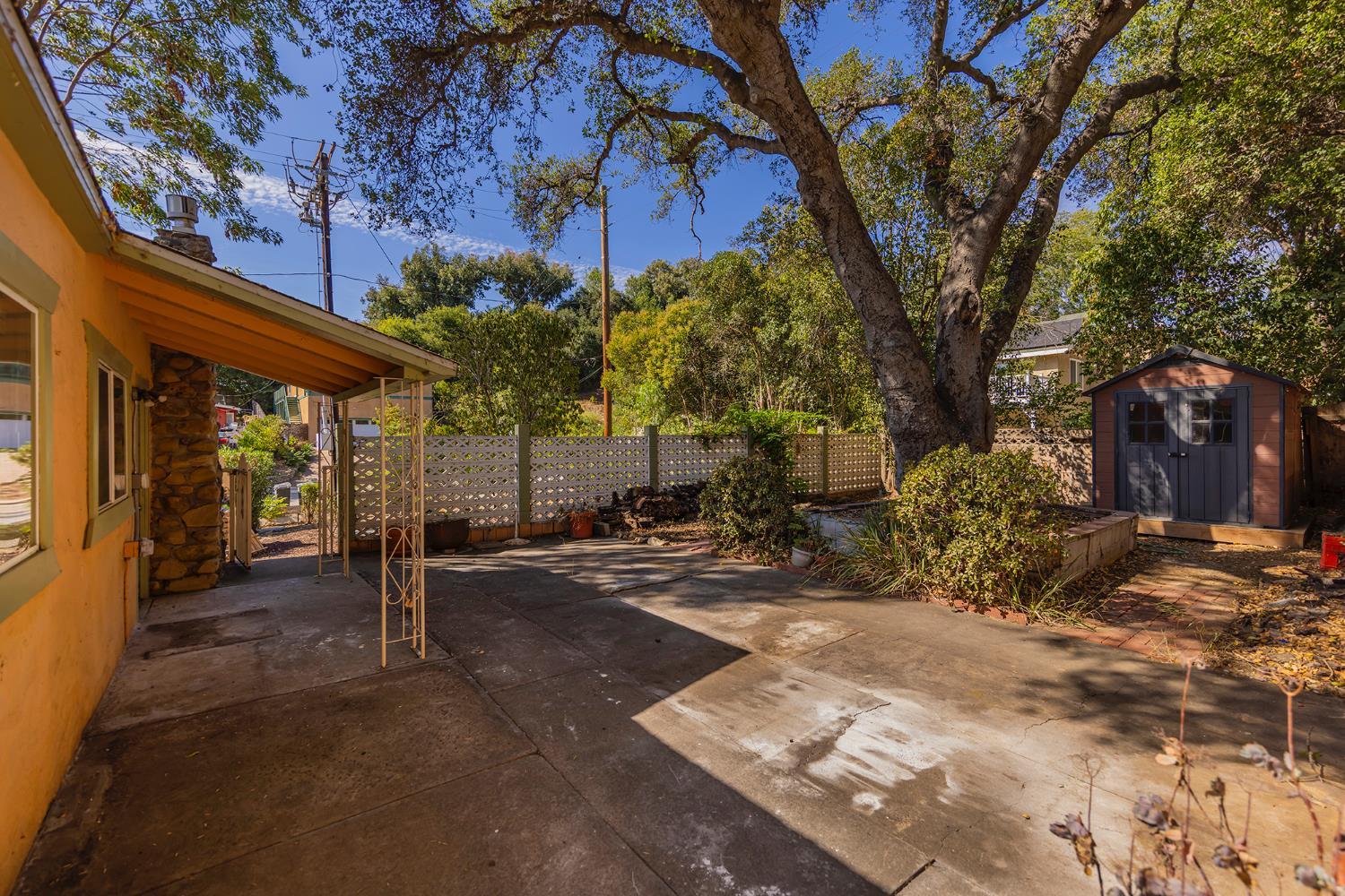 228 High Street Oak View, CA 93022 - Photo 17 of 28 a view of a patio with table and chairs and potted plants