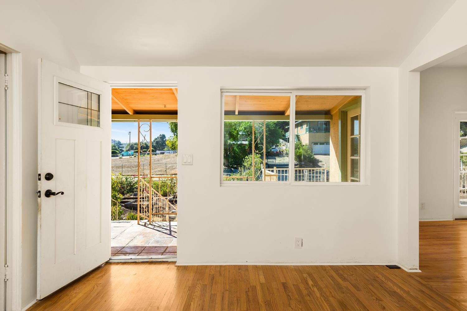 228 High Street Oak View, CA 93022 - Photo 4 of 28 an empty room with wooden floor and windows