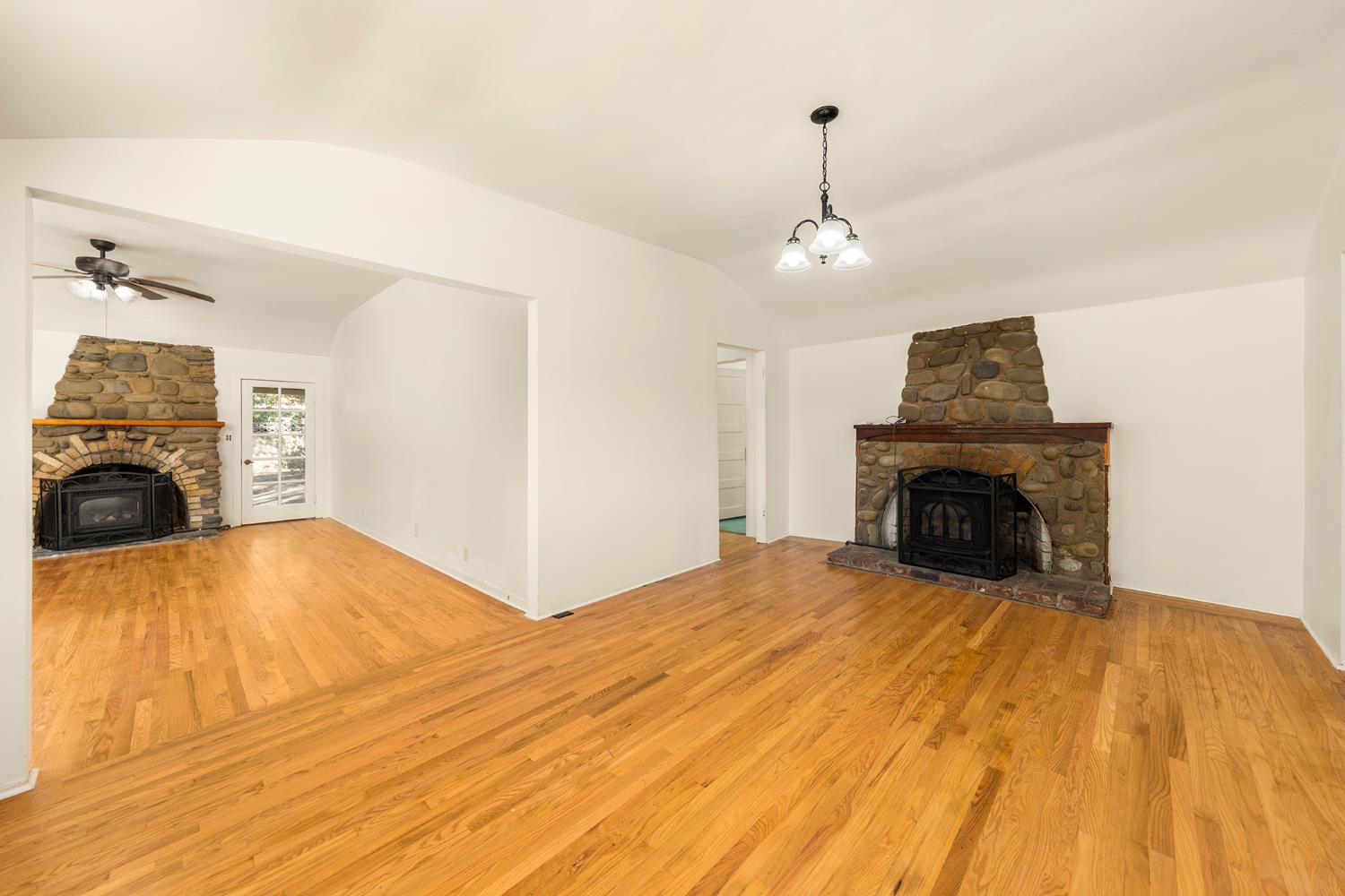 228 High Street Oak View, CA 93022 - Photo 5 of 28 a view of empty room with fireplace and wooden floor