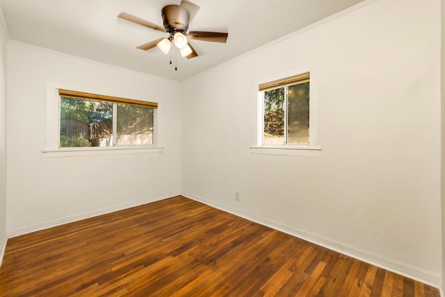 228 High Street Oak View, CA 93022 - Photo 8 of 28 a view of empty room with wooden floor and fan