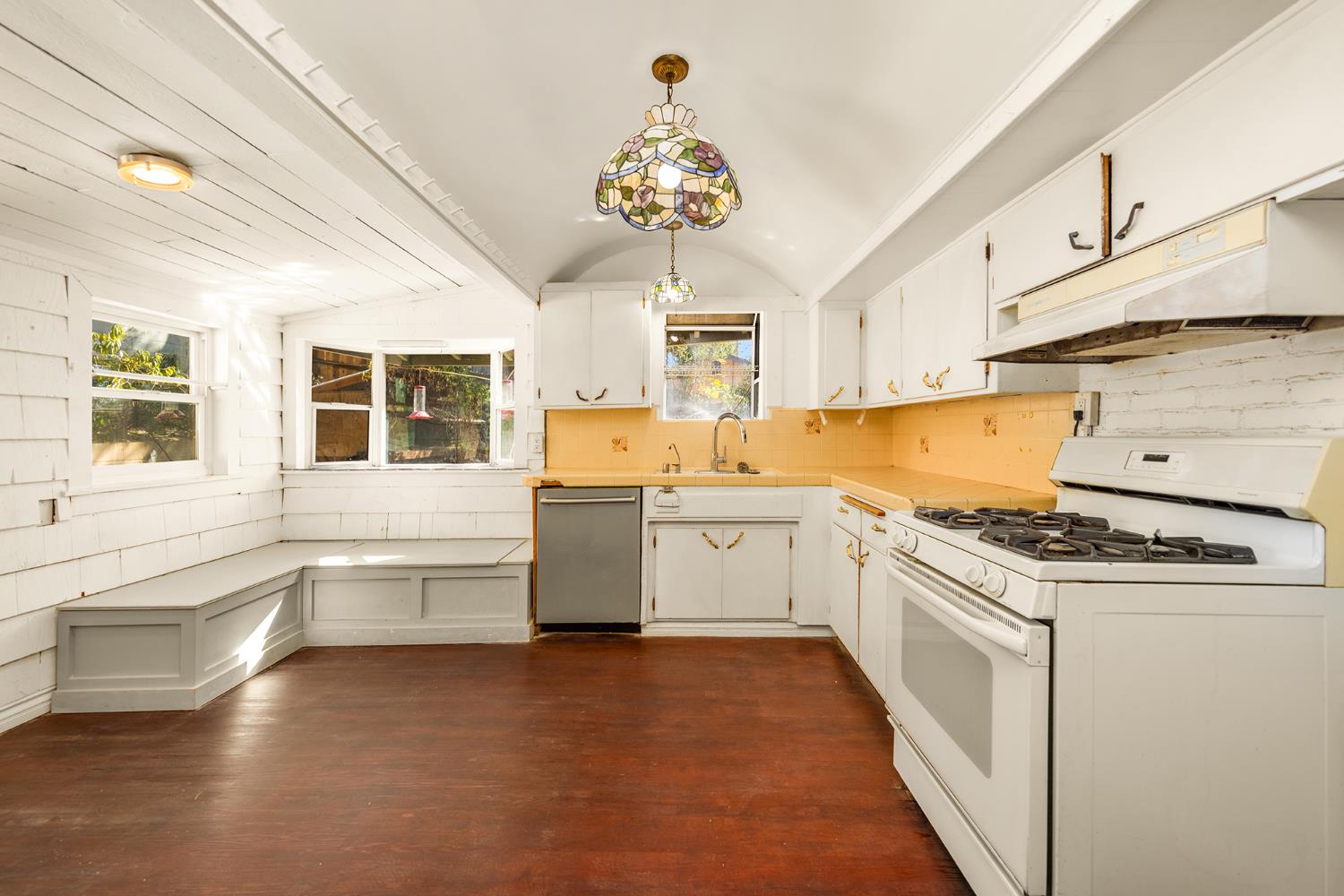 228 High Street Oak View, CA 93022 - Photo 10 of 28 a kitchen with stainless steel appliances granite countertop a stove a sink and a refrigerator
