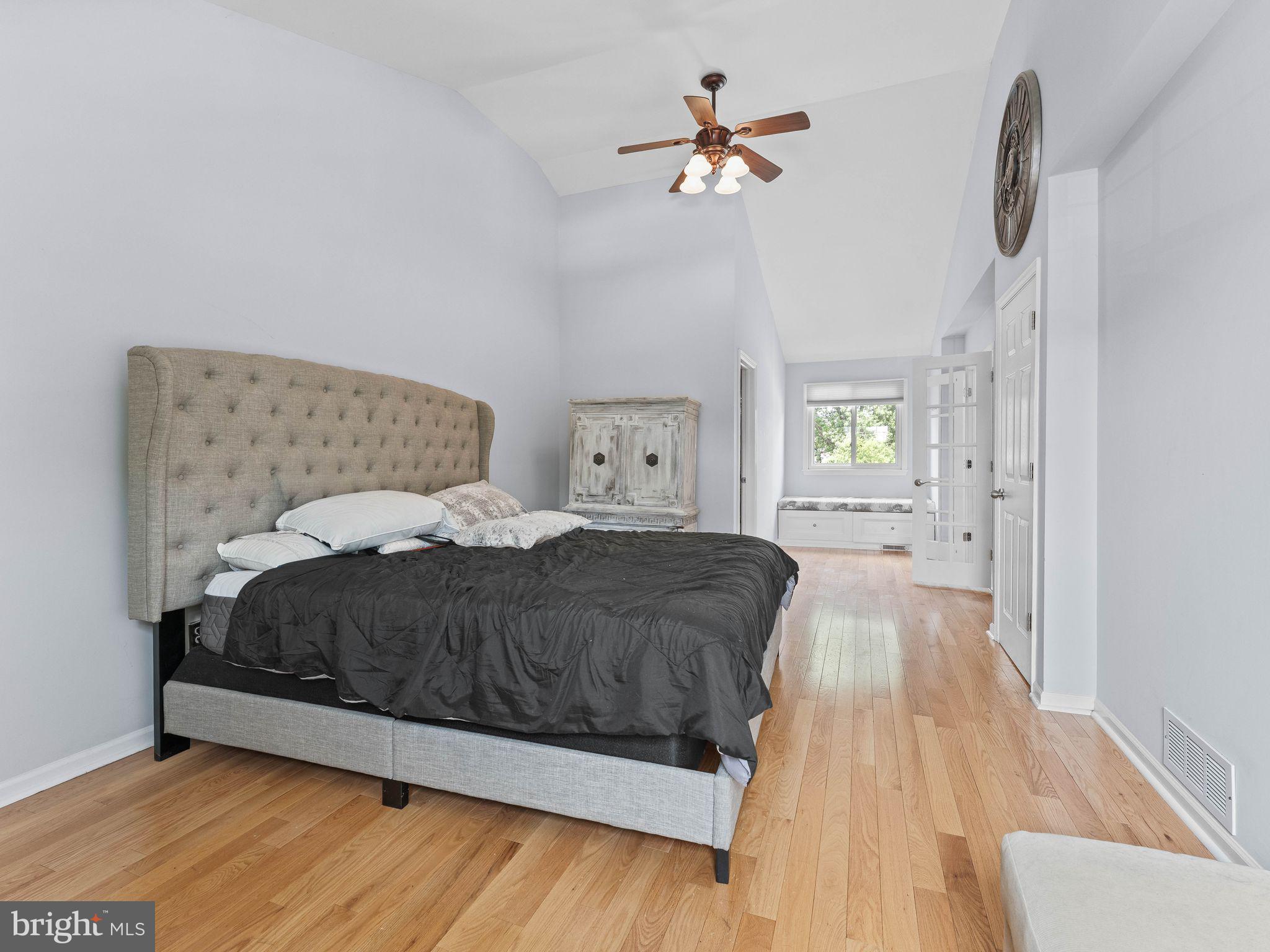 8 Chesterfield Road Sewell, NJ 08080 - Photo 24 of 57 a spacious bedroom with a bed and a chandelier