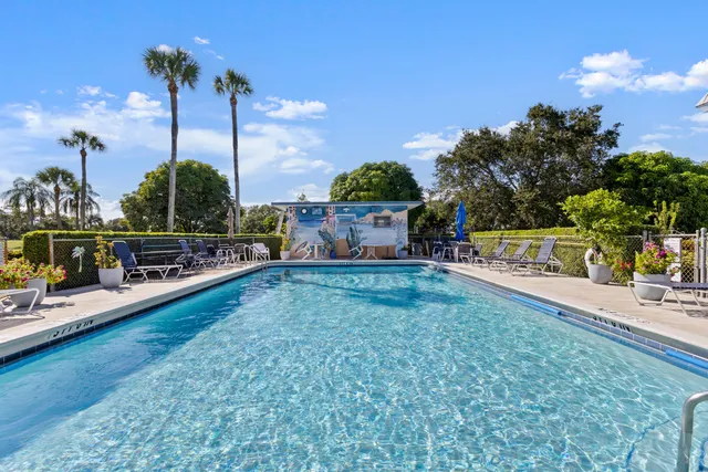 a view of a swimming pool with a patio