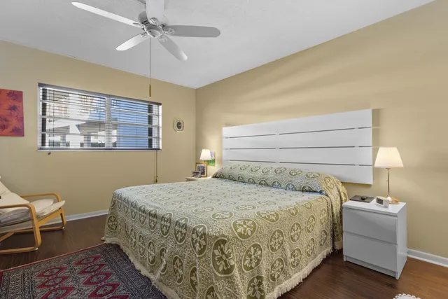 a bedroom with a bed and a lamp