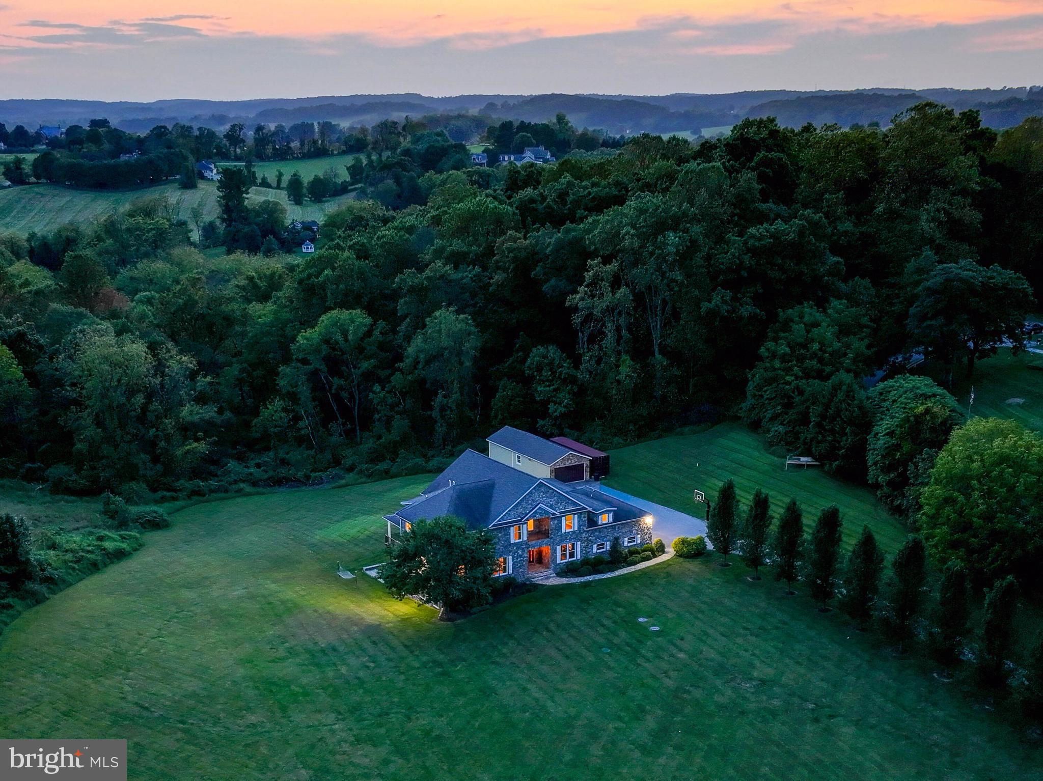 14412 Cuba Road Cockeysville, MD 21030 - Photo 11 of 35 a view of a big yard with lawn chairs and large trees