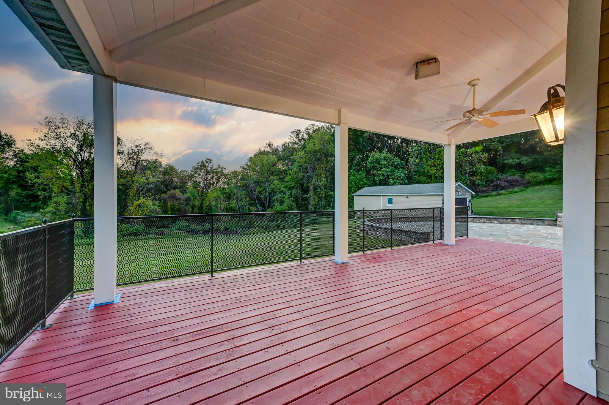 14412 Cuba Road Cockeysville, MD 21030 - Photo 16 of 35 a view of a deck with a big yard potted plants and floor to ceiling window
