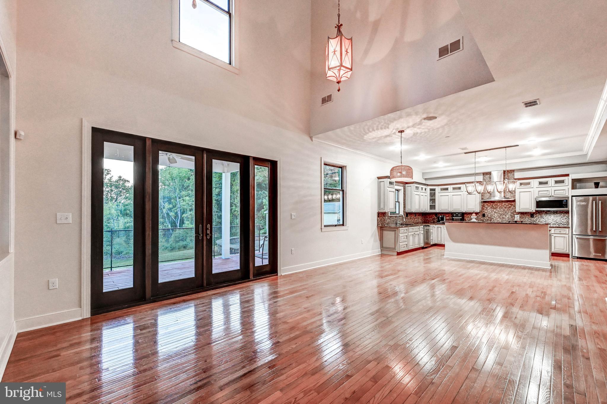 14412 Cuba Road Cockeysville, MD 21030 - Photo 17 of 35 a view of an empty room with kitchen view and a window