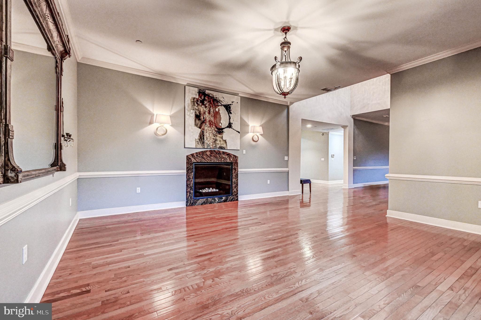 14412 Cuba Road Cockeysville, MD 21030 - Photo 20 of 35 a view of empty room with wooden floor and fireplace