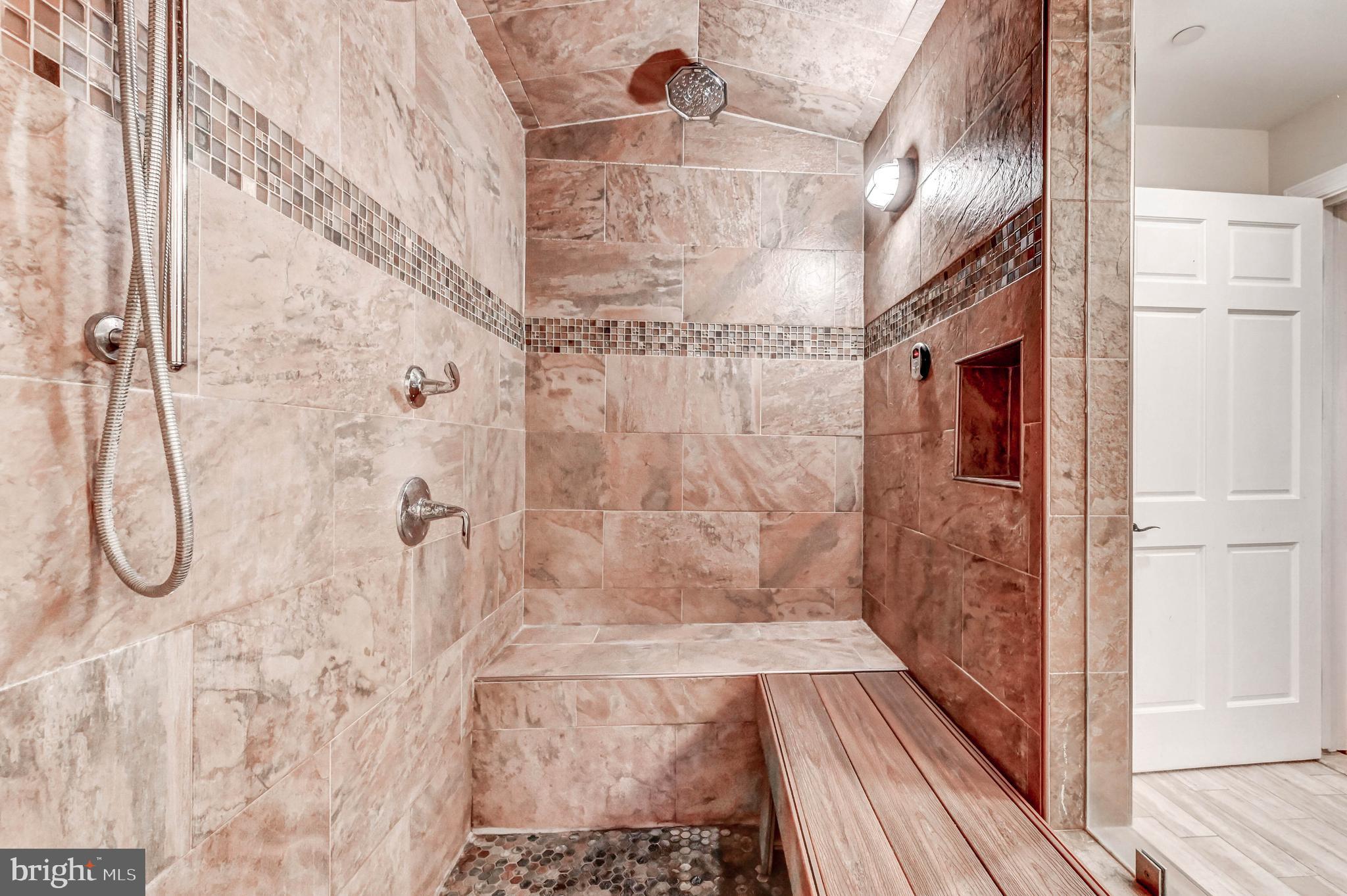 14412 Cuba Road Cockeysville, MD 21030 - Photo 24 of 35 a bathroom with a glass shower door