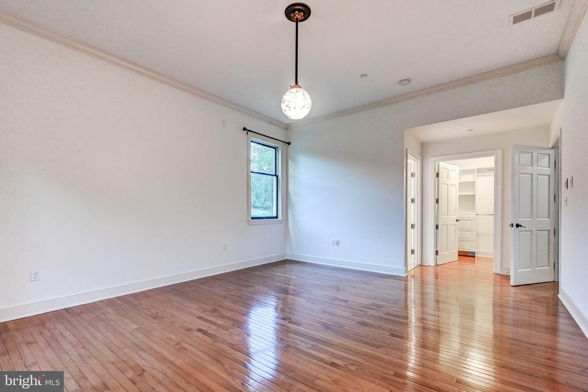 14412 Cuba Road Cockeysville, MD 21030 - Photo 27 of 35 a view of an empty room with wooden floor and windows