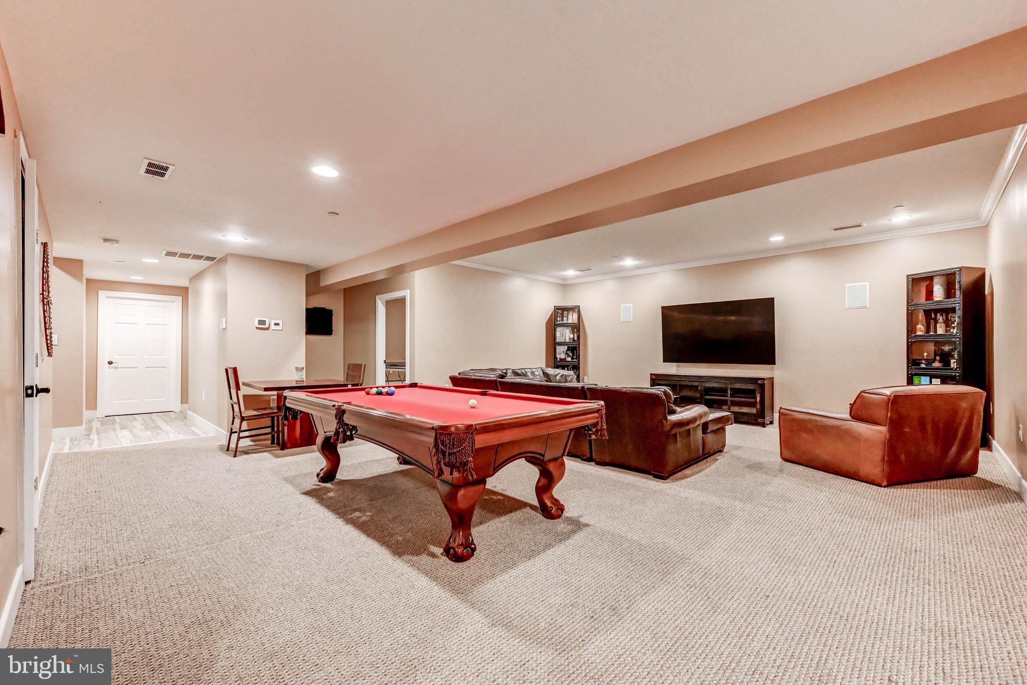 14412 Cuba Road Cockeysville, MD 21030 - Photo 29 of 35 a living room with furniture and a flat screen tv