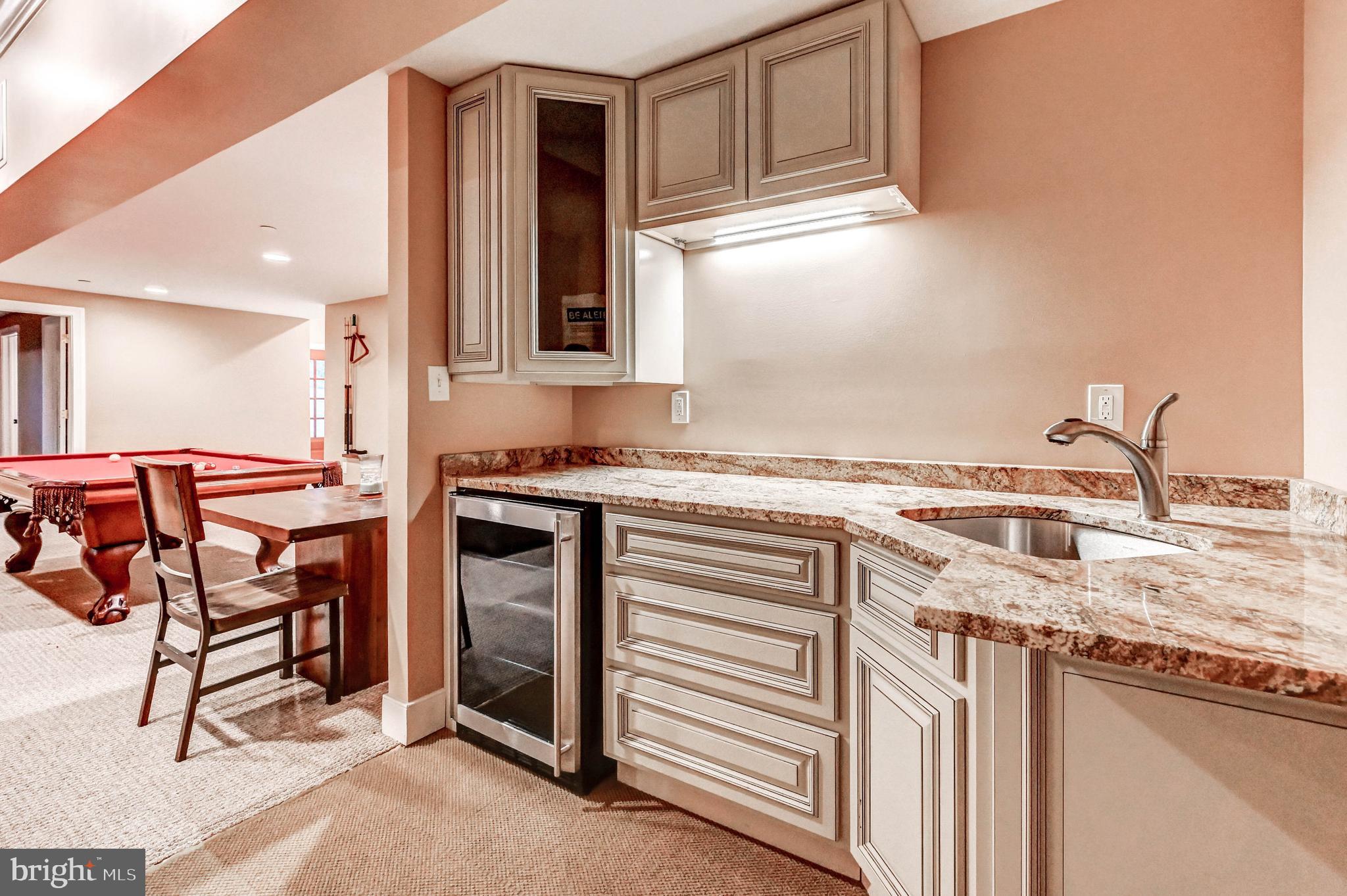 14412 Cuba Road Cockeysville, MD 21030 - Photo 30 of 35 a kitchen with stainless steel appliances granite countertop a sink and a stove