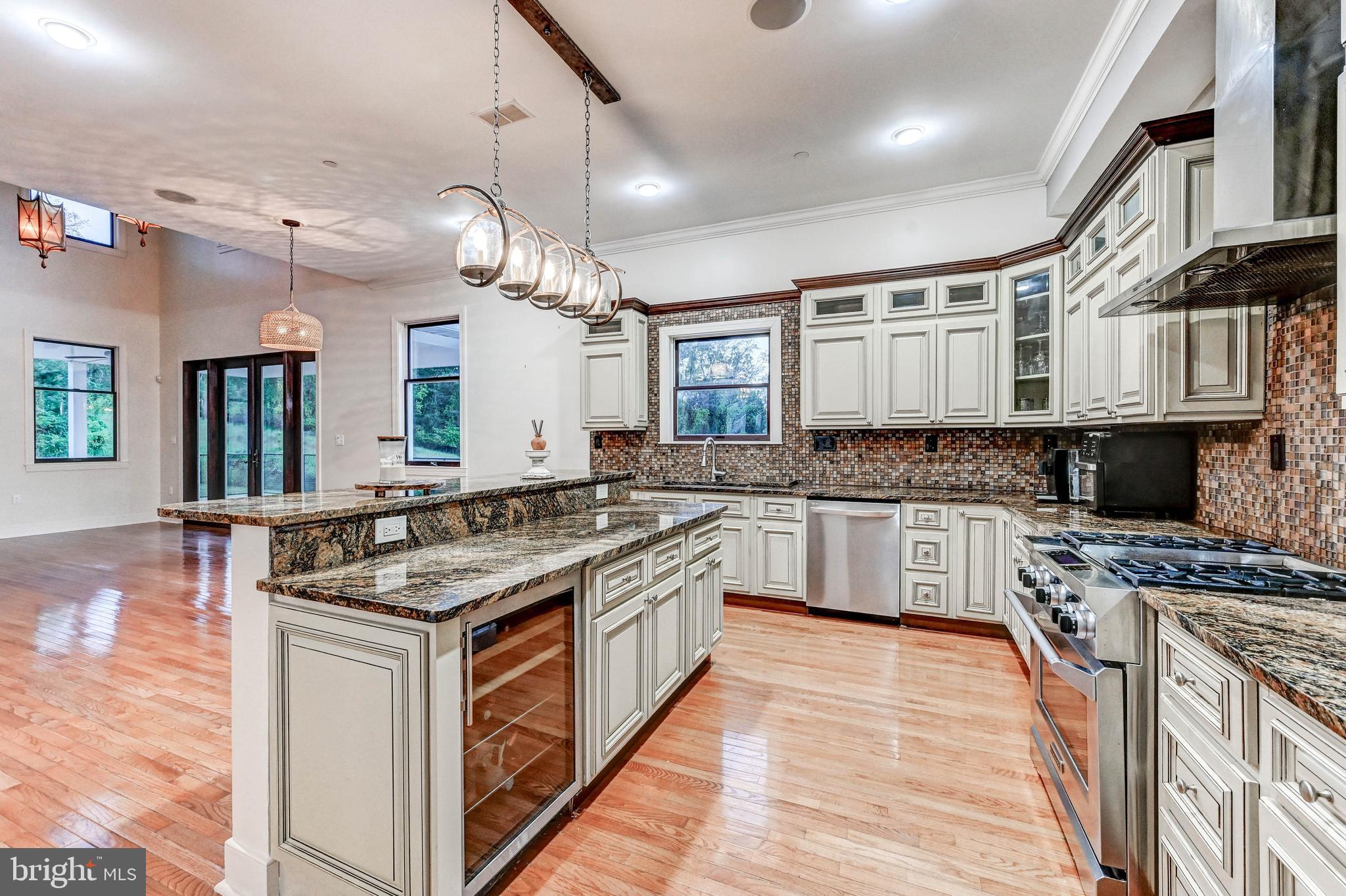 14412 Cuba Road Cockeysville, MD 21030 - Photo 3 of 35 a kitchen with stainless steel appliances granite countertop a stove and cabinets