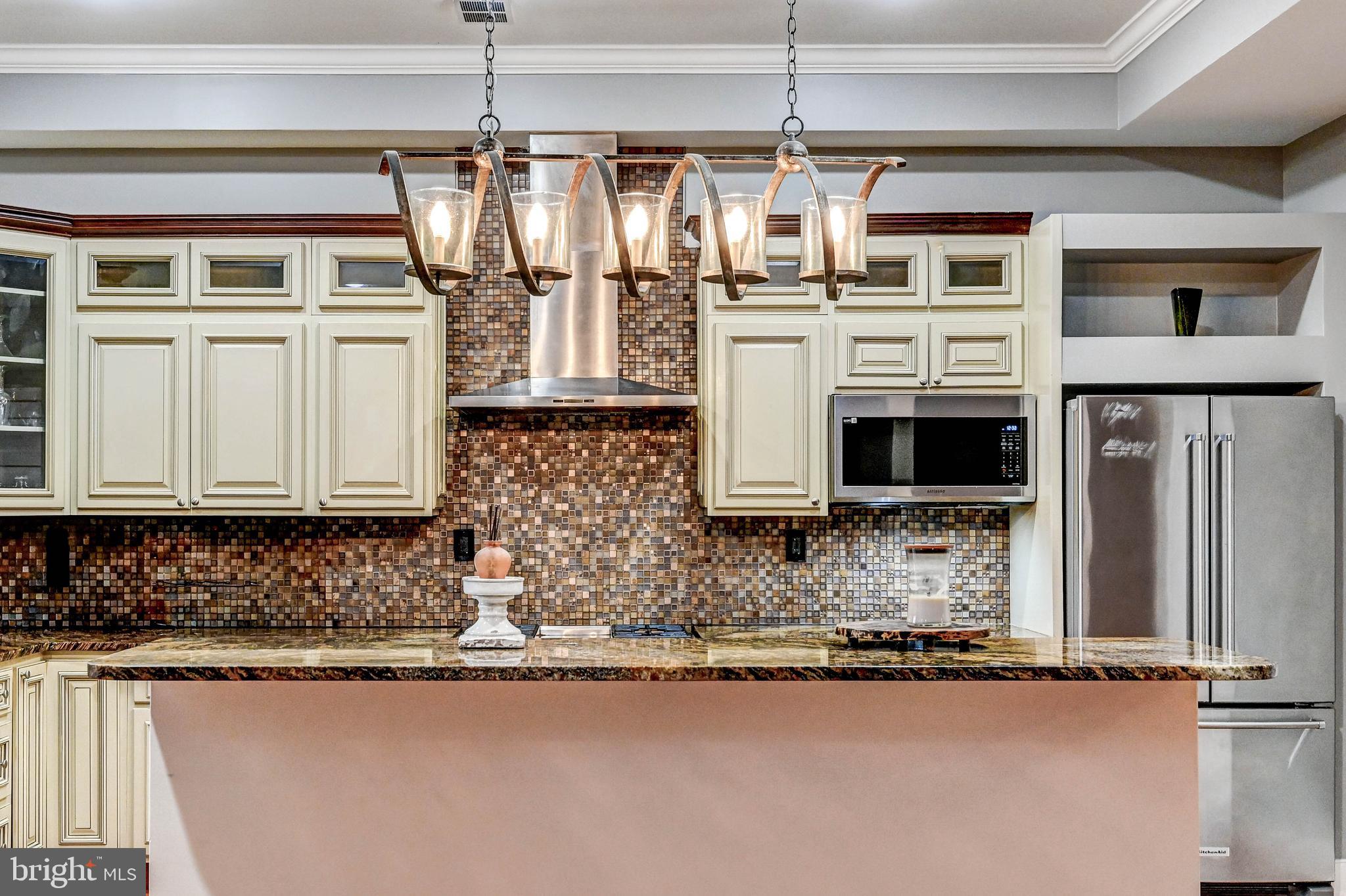 14412 Cuba Road Cockeysville, MD 21030 - Photo 32 of 35 a kitchen with stainless steel appliances granite countertop a sink a stove and a microwave