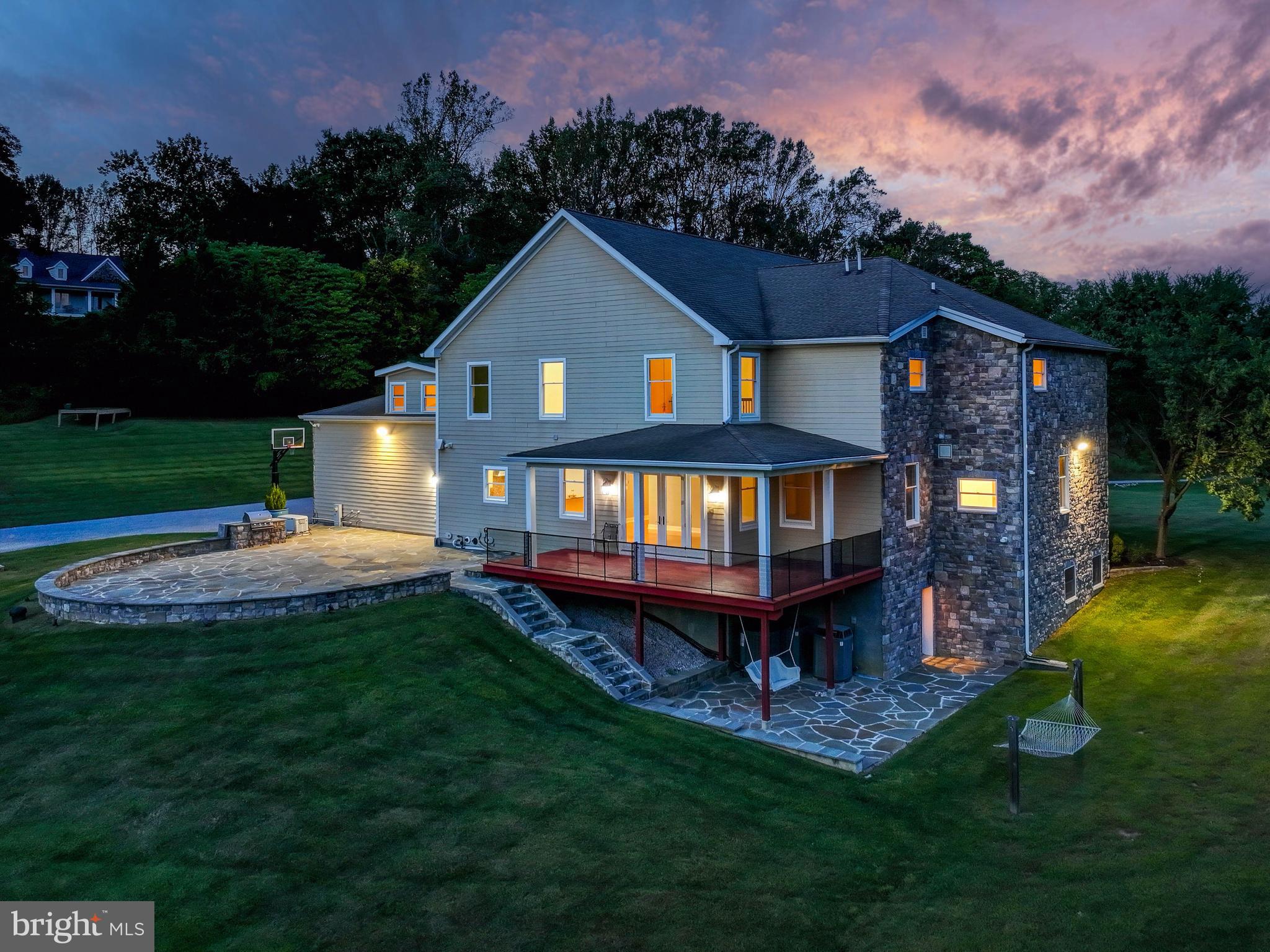 14412 Cuba Road Cockeysville, MD 21030 - Photo 7 of 35 a front view of a house with a yard table and chairs