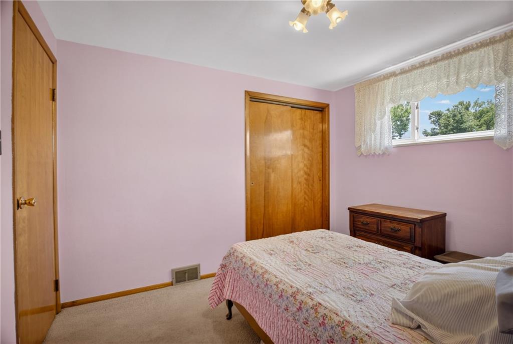 186 William Street McKees Rocks, PA 15136 - Photo 21 of 45 a bedroom with a bed and a chandelier