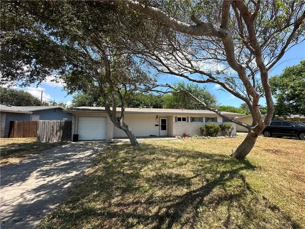 a house with trees in front of it