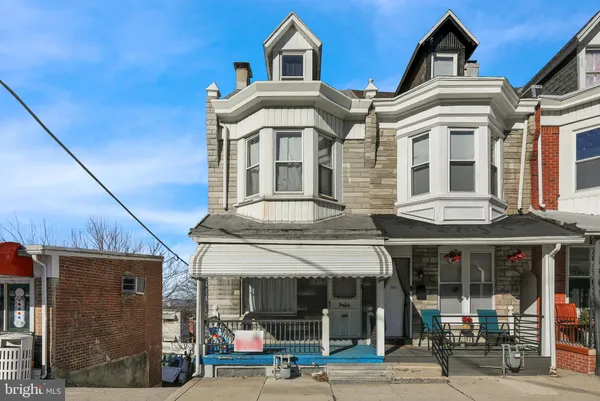 a front view of a building with a porch
