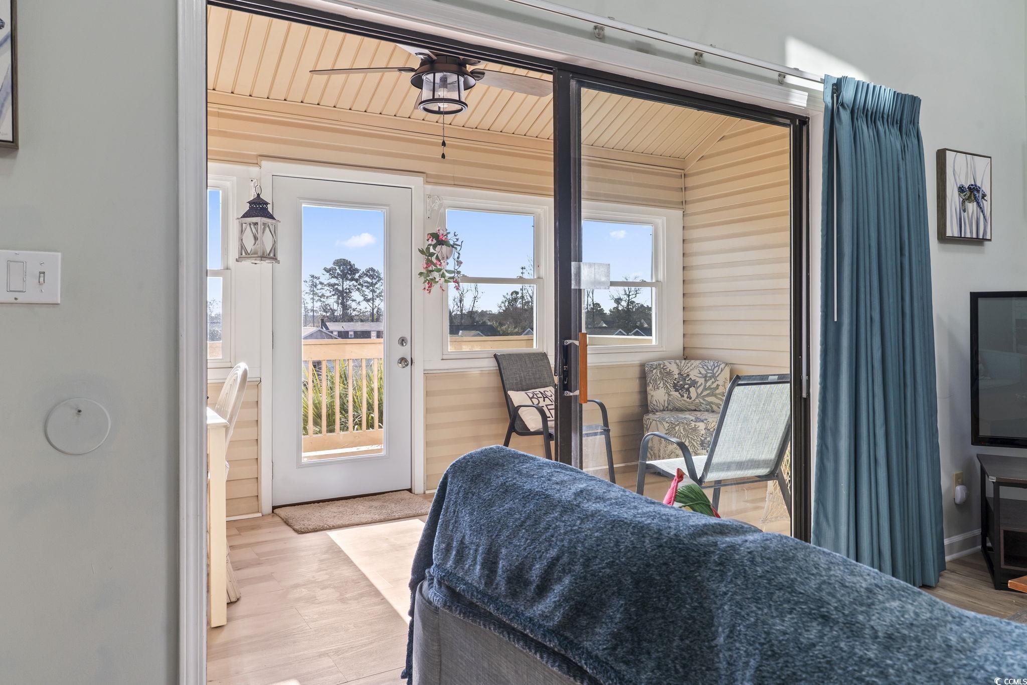 207 Double Eagle Drive, Unit F3 Myrtle Beach, SC 29575 - Photo 20 of 40 Sunroom featuring wood finished floors