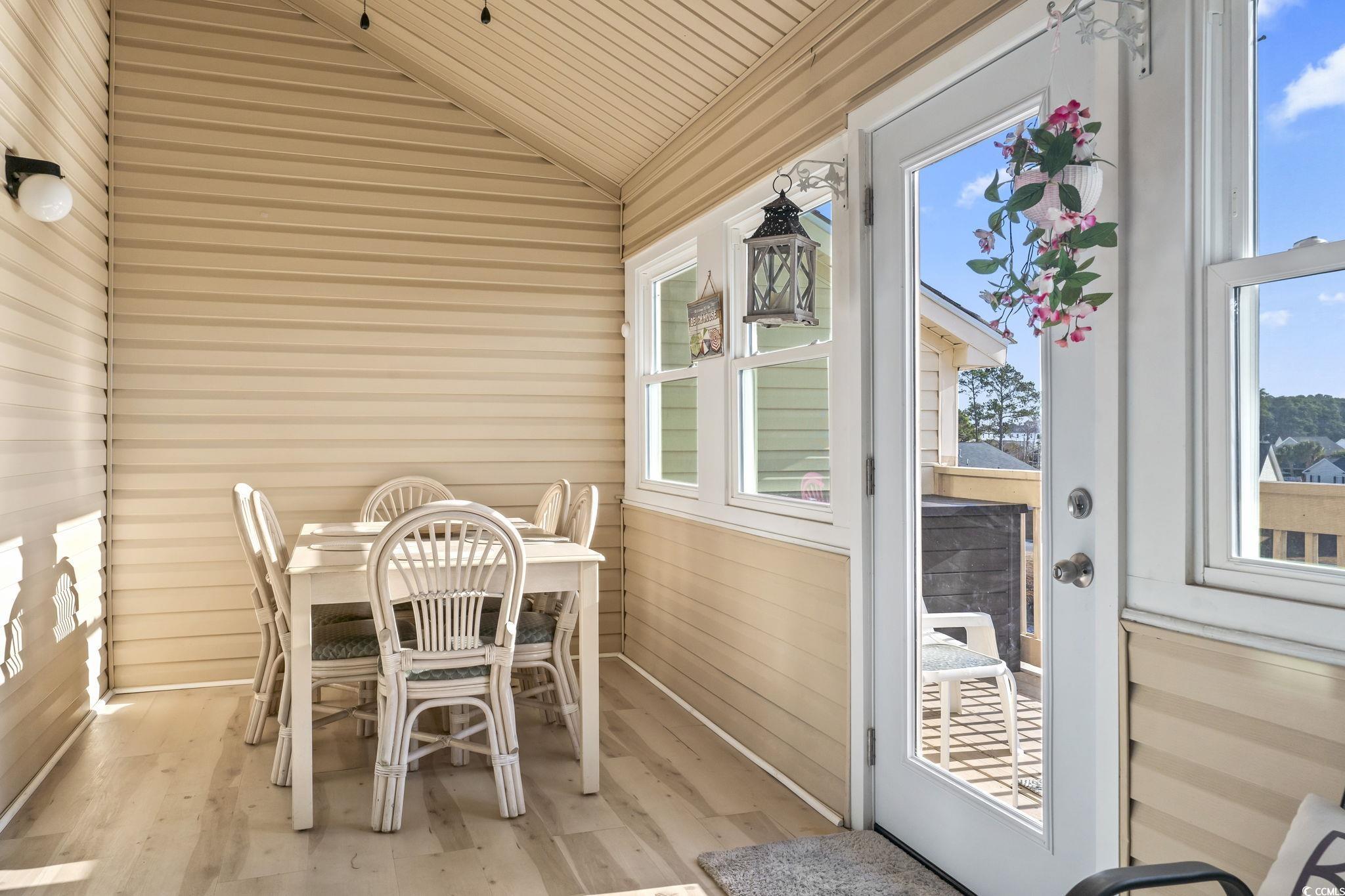 207 Double Eagle Drive, Unit F3 Myrtle Beach, SC 29575 - Photo 22 of 40 Sunroom featuring vaulted ceiling and healthy amount of natural light