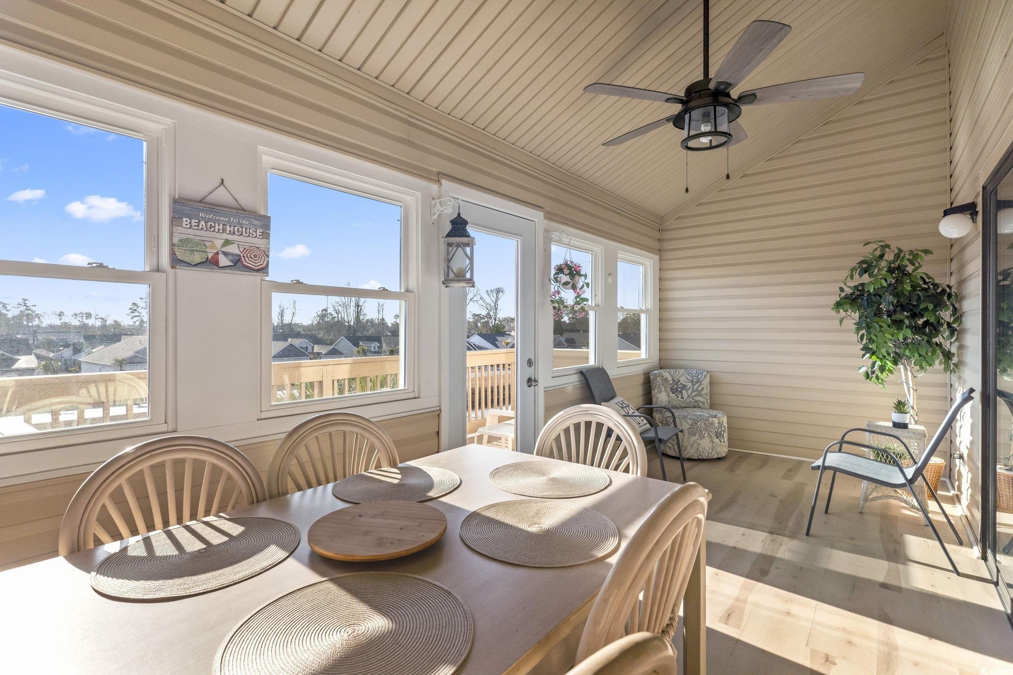 207 Double Eagle Drive, Unit F3 Myrtle Beach, SC 29575 - Photo 25 of 40 Sunroom / solarium featuring wooden ceiling, vaulted ceiling, and wood finished floors