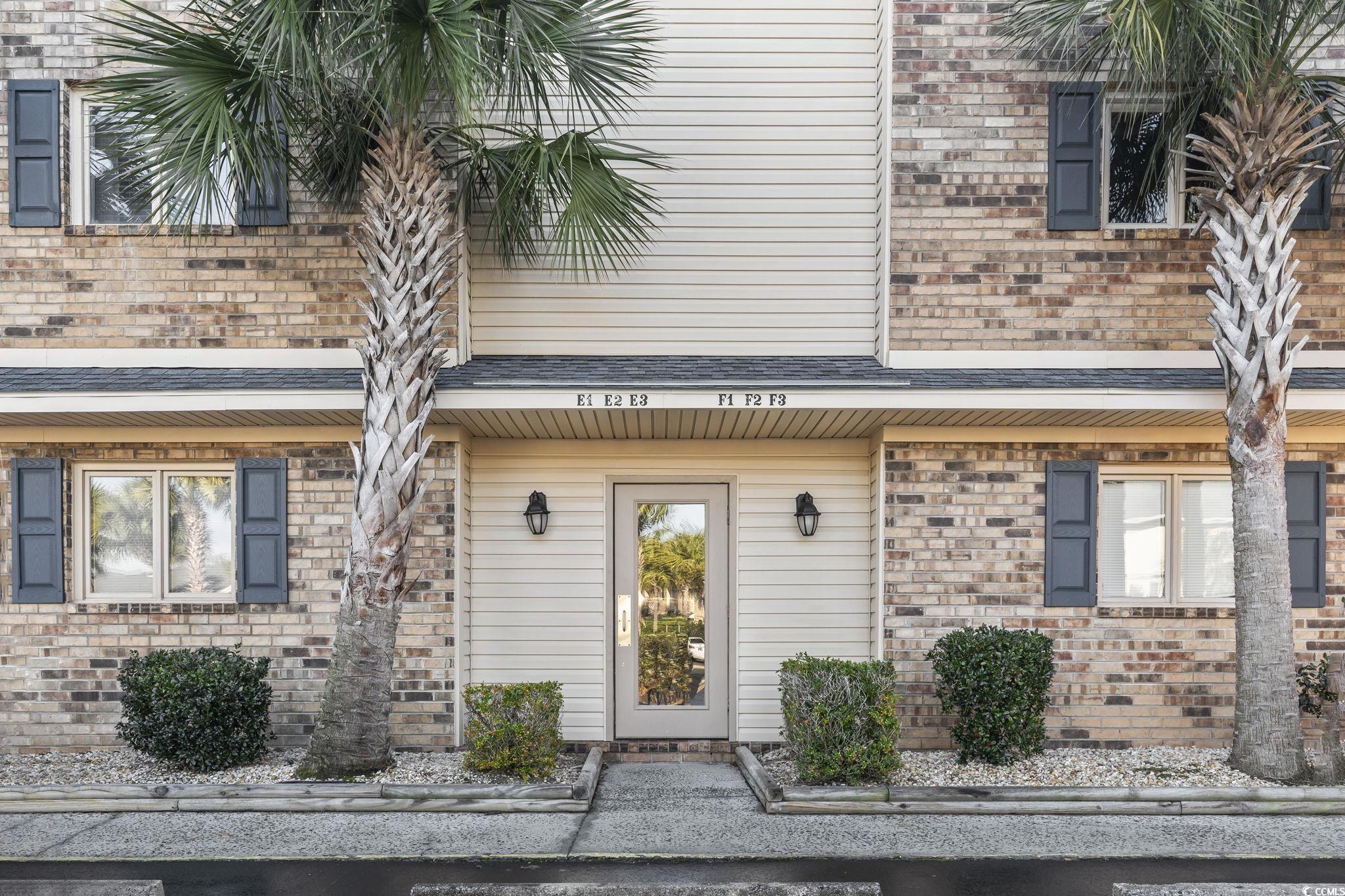 207 Double Eagle Drive, Unit F3 Myrtle Beach, SC 29575 - Photo 3 of 40 Doorway to property featuring brick siding
