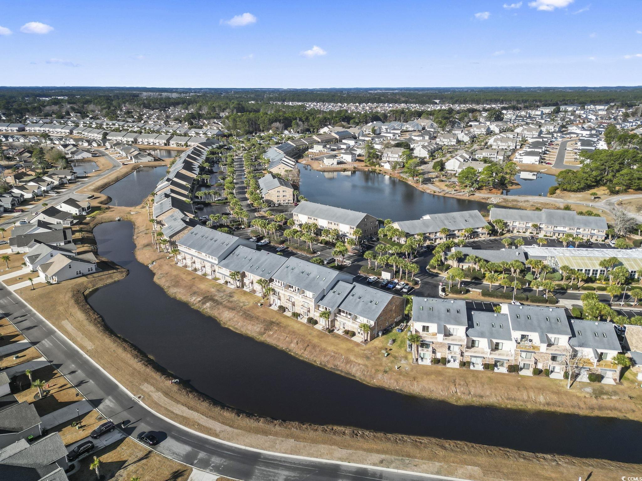 207 Double Eagle Drive, Unit F3 Myrtle Beach, SC 29575 - Photo 39 of 40 Aerial overview of property's location with nearby suburban area and a large body of water